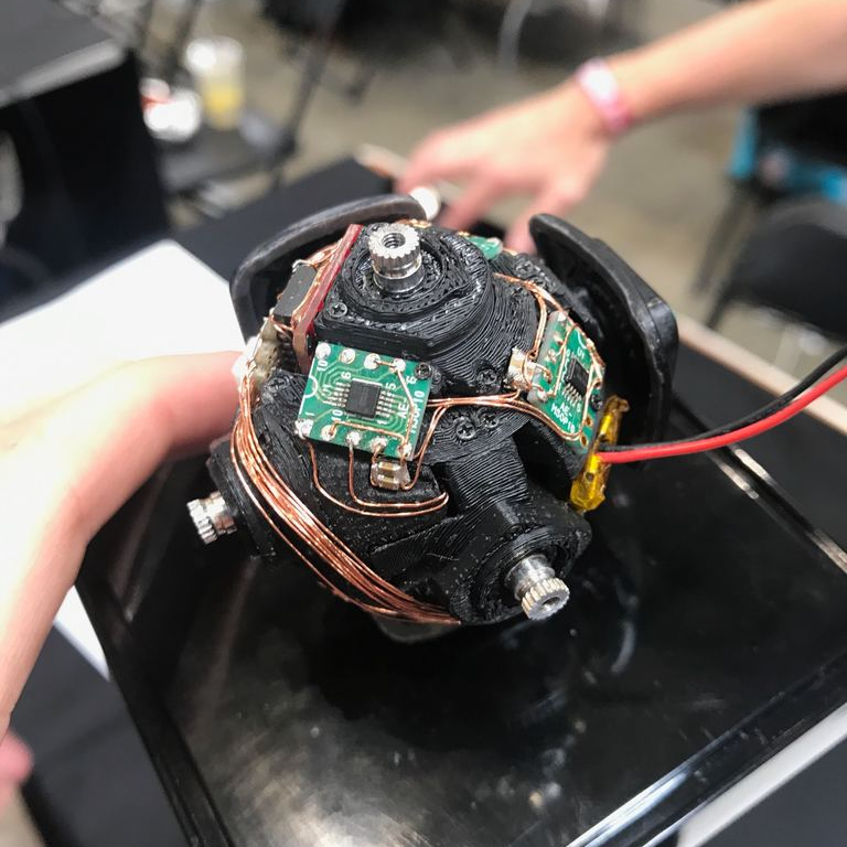 Hacksterio's tweet photo. A look inside the self-solving Rubik's cube. #MFBA19 https://t.co/w4Xi43ASU1