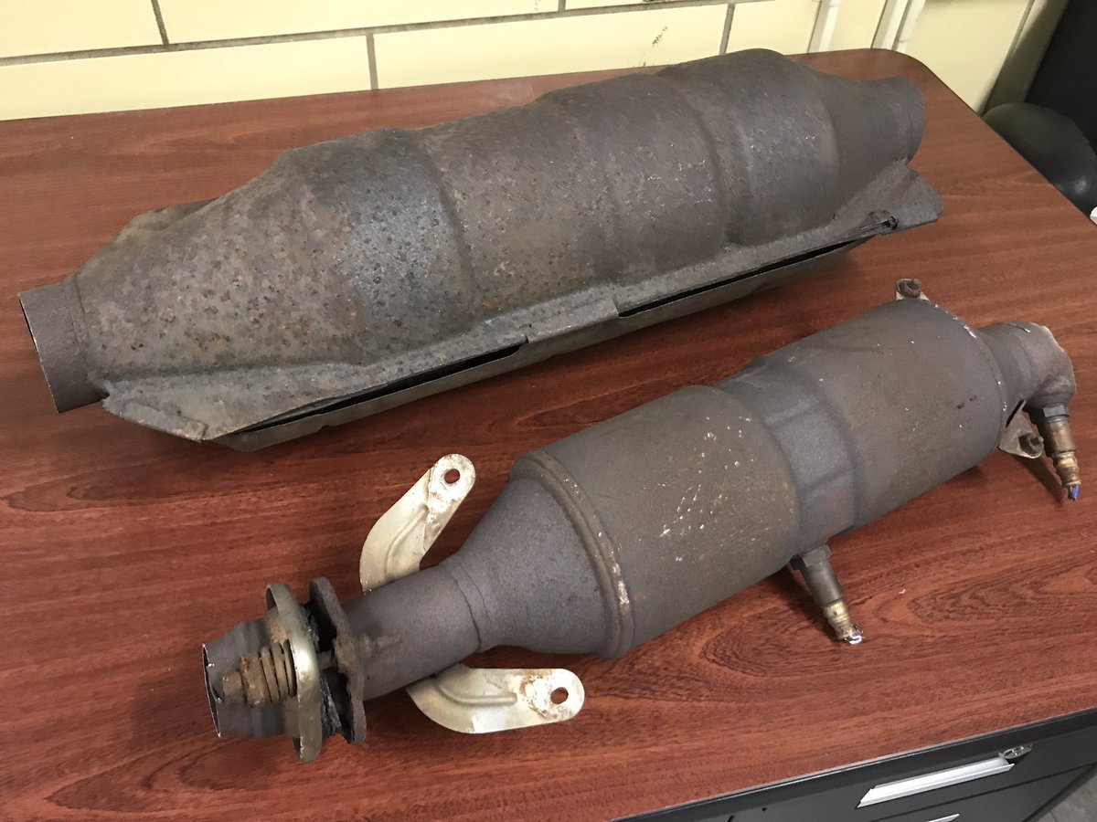 Two catalytic converters on a table.