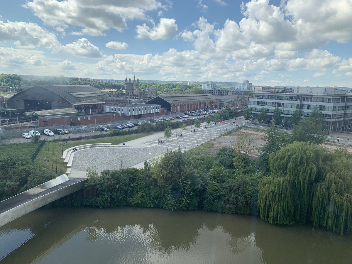 SWToursUK's tweet photo. A splendid and unusual view of Bristol Temple Meads station and Brunel’s original Passenger and Engine Shed. Feeder channel in the foreground. #visitbristol #avalonheritage1 https://t.co/d88qz8SUQM