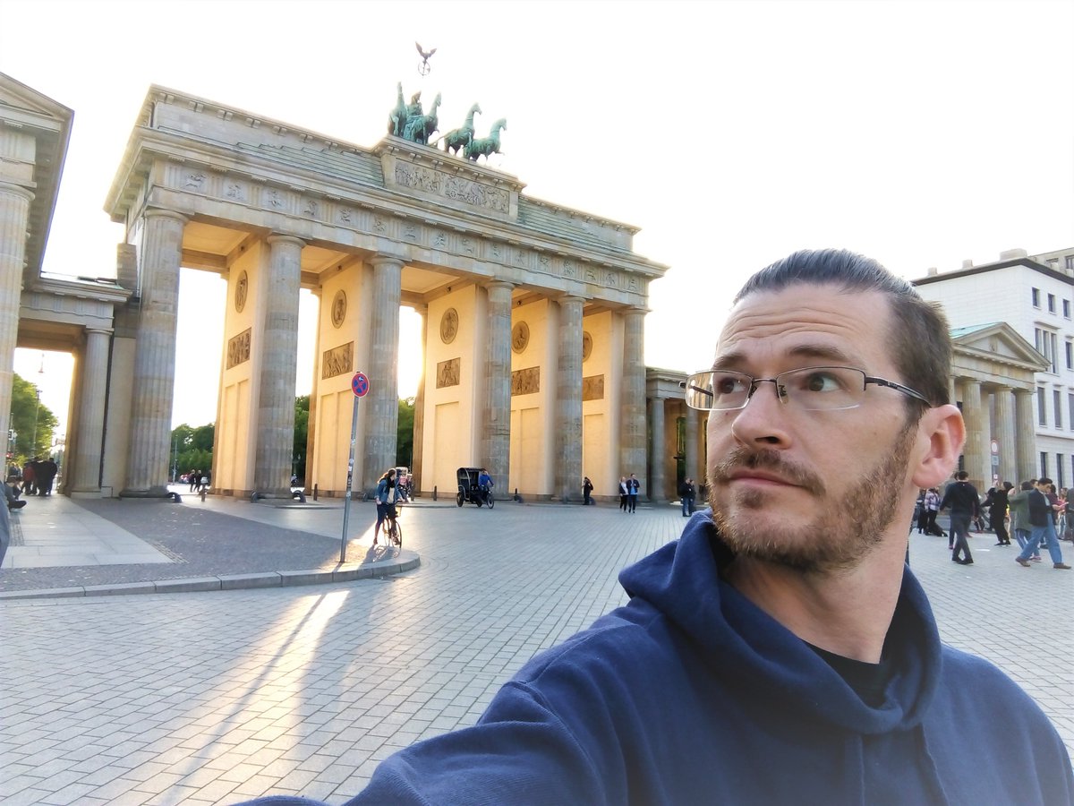 #GuessWhere!  
Probably the most famous gate in the world, built 1788-1791, it was designed as a symbol of peace.  But it has been used as a symbol for triumph/victory by France, Prussia, the Nazis, USSR, and (one could argue) the USA.  
Bonus: Who is on top of the gate?