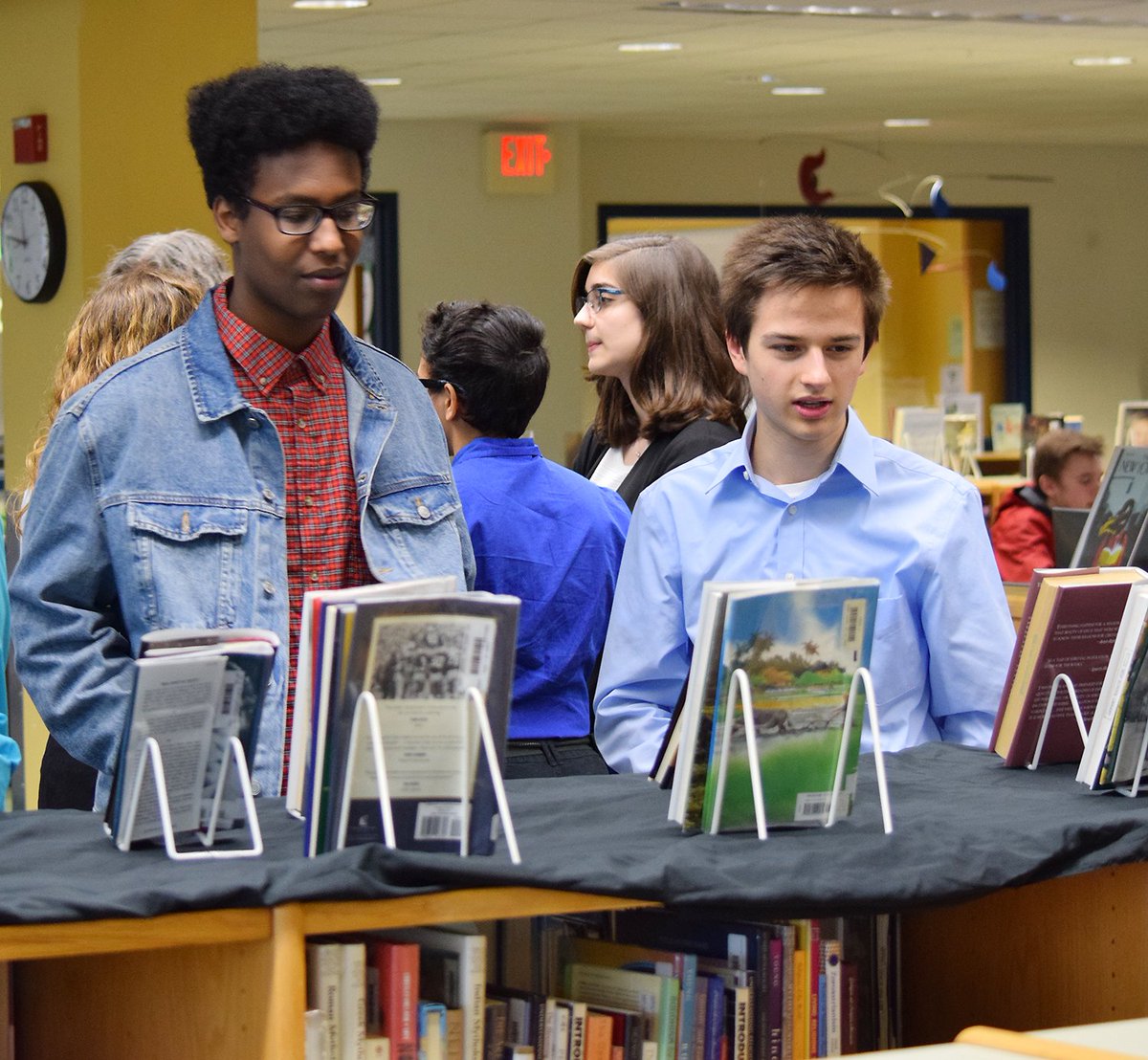 EssexWestford's tweet photo. Students from the Design &amp; Creative Media 1 program at @CTEforTech recently took part in a book jacket rebranding project. On May 10, a reception was held in the @EHSCTElibrary to announce the winning book jacket redesigns. #EWSD https://t.co/r9mmT2os3O