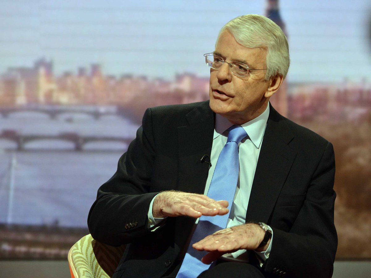John Major holds an invisible box before revealing an invisible rabbit during an interview with Andrew Marr