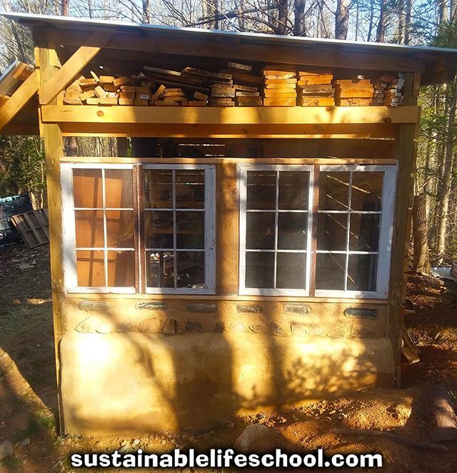 SusLifeSchool's tweet photo. Here's a picture of the outside of our woodshed as I was still working on it. You can see the storage spot we have for boards up top, to keep them out of the rain. The windows are freebies, gotten of of craigslist. The base of the wall is #earthbag, followed by #cordwood and… https://t.co/hOcVTAuVqr