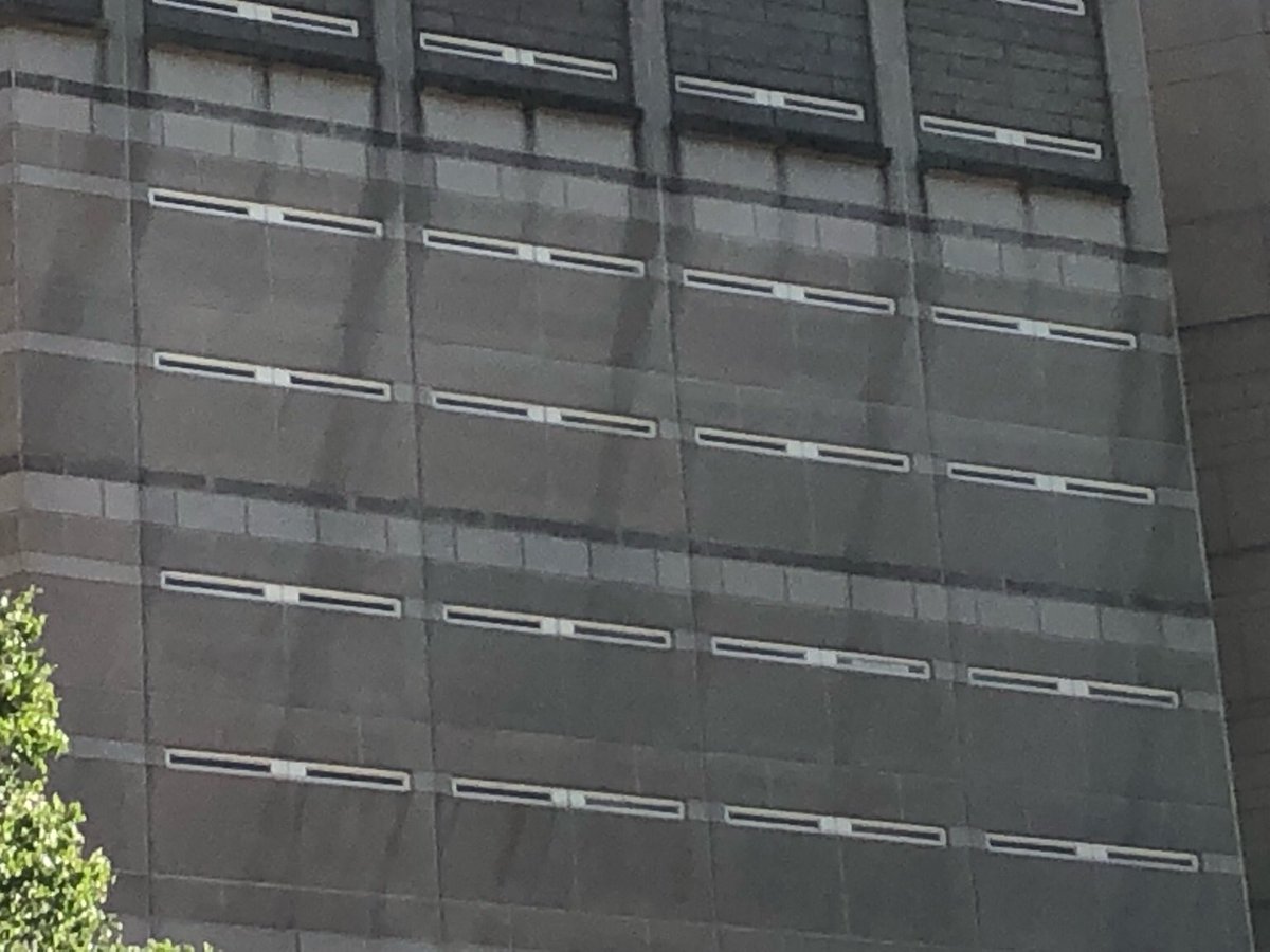 UPDATE: #DekalbCountyJail has BLOCKED the windows of the street-facing side of the jail to prevent inmates from communicating w/ the outside via signs, which has been one of the only channels of communication. 

(Clear windows on the right for comparison)

#JusticeForInmates