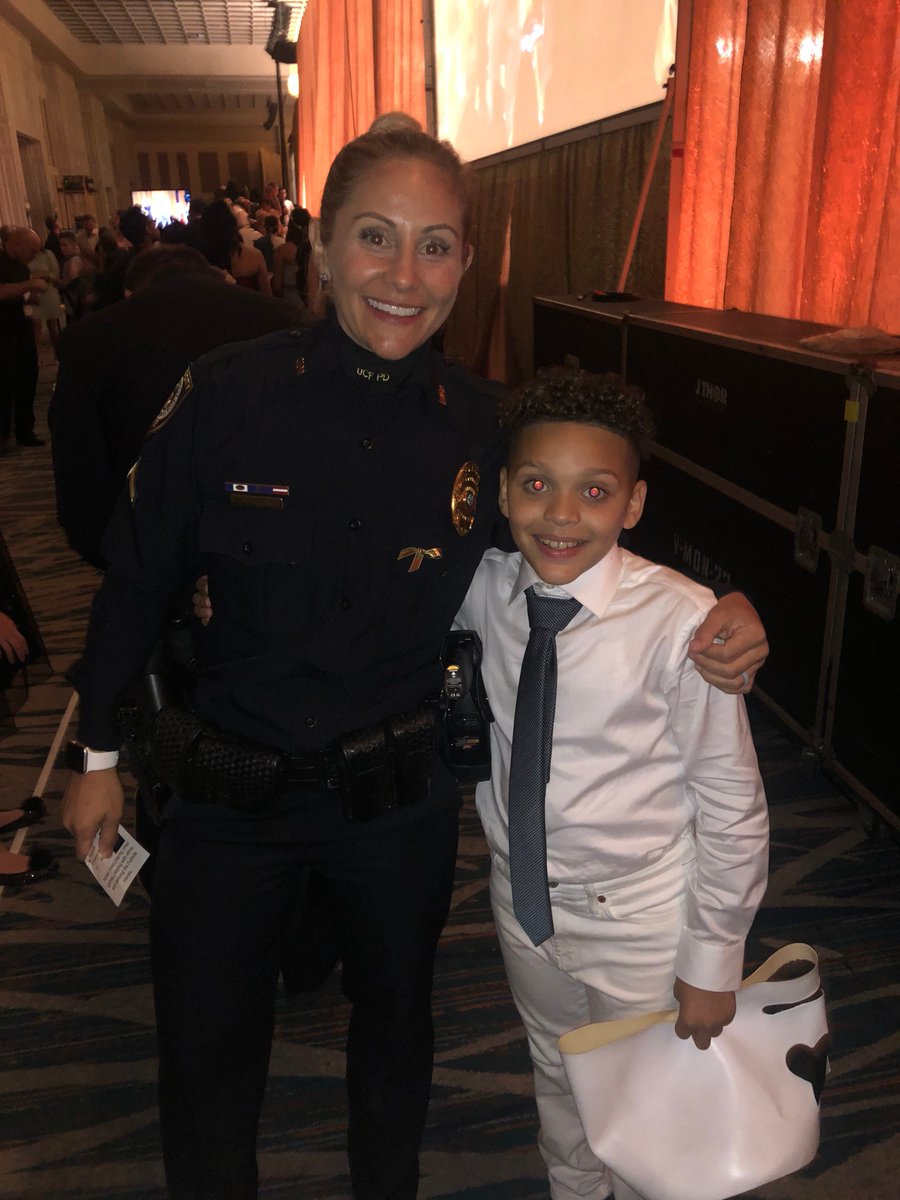 UCFPolice's tweet photo. On Saturday Commander Freeman and Detective Guadagnino had the honor of participating in @RunwayToHope, which raises support for an end to childhood cancer. They had the best time escorting these cancer warriors down the runway! #RunwayToHope https://t.co/6Qs4pnm9Ex