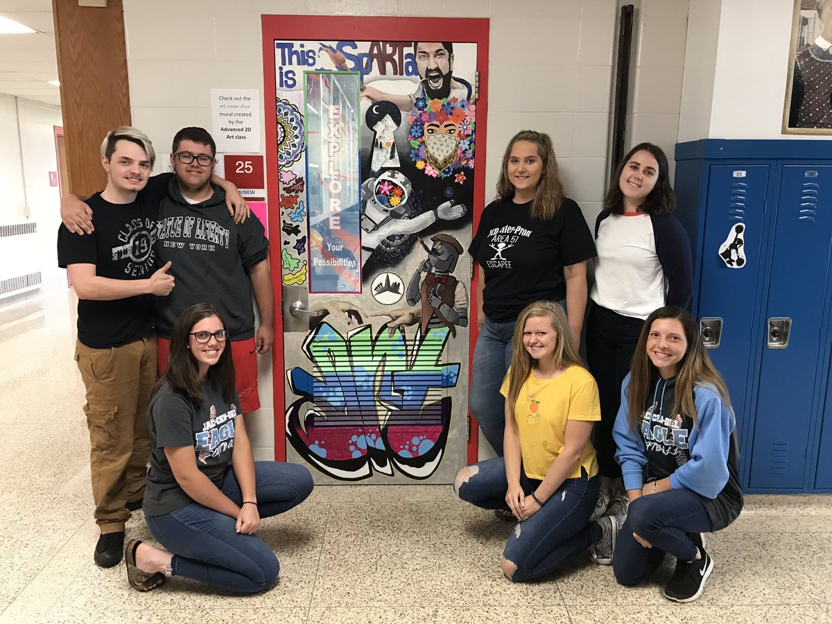 JCDArtClub's tweet photo. Here are the amazing artists with the #door #mural they created. On the left, Lane Wilson, Austin Hughes, and Karlee Wolfe - all seniors. On the right, Danielle Engel, Emma Schmiedel, also seniors. And juniors, Abigail Broadwater and Emily Adams. #jcdpride https://t.co/G4TObhPNJu