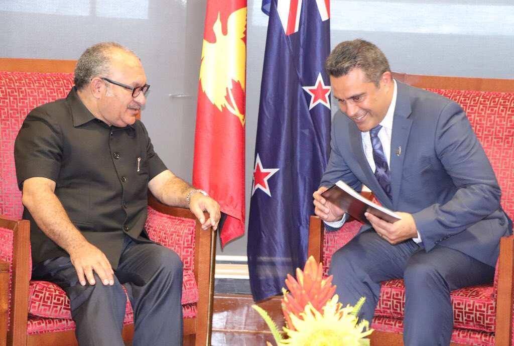 pm_nec's tweet photo. The Prime Minister, Hon. Peter O’Neill CMG MP, has welcomed the new High Commissioner of New Zealand to Papua New Guinea, His Excellency, Philip Taula.
Photos: Prime Minister Peter O'Neill speaking with H.E Philip Taula, his wife Lidwina Taula and daughter Mia Taula. https://t.co/mhgG22Rc5y
