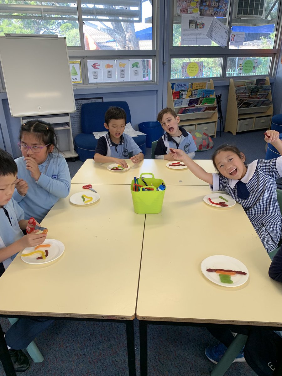 Learning about equal parts to a whole (fractions) with lolly snakes. Love Yr1 maths