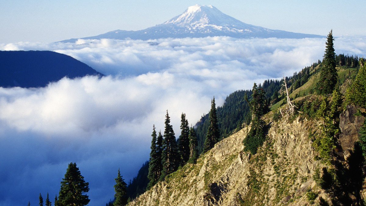 View of Mount Adams above a cloud-filled valley in Washington