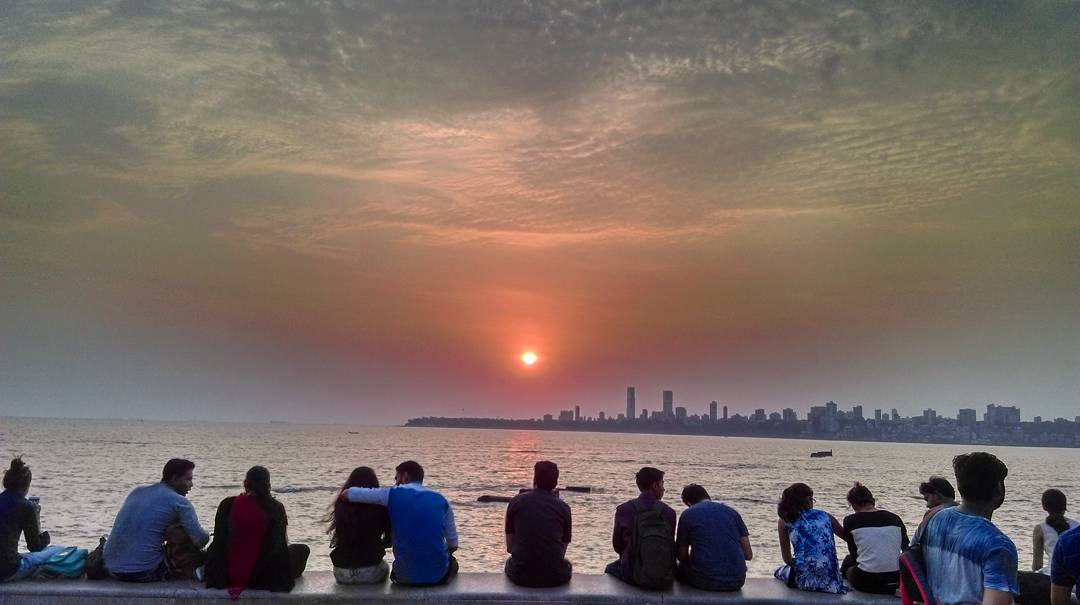 Bombay minds its own business. Every evening, a young MT will stumble out of his office building, sit between a man wearing eye make-up and a woman wearing a power suit, and enjoy a stunning sunset. And he'll never want to leave this city again. (pic by Rohit Dubey).