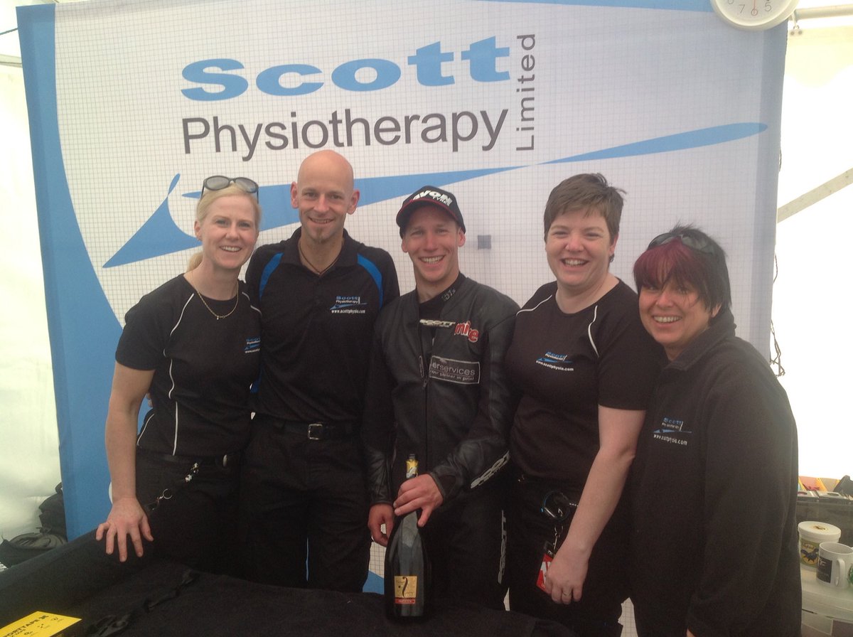 Scottphysio's tweet photo. The @Scottphysio TT team just love helping racers through the challenges that racing brings. We so enjoy seeing racers achieve their goals and dreams whatever they are. Sidecar passenger Mike Aylott popped in after his podium to share some of his bubbly 😀😀😀🍾🍾🍾⭐️👍#TT2015 https://t.co/XoV1VYsfdd