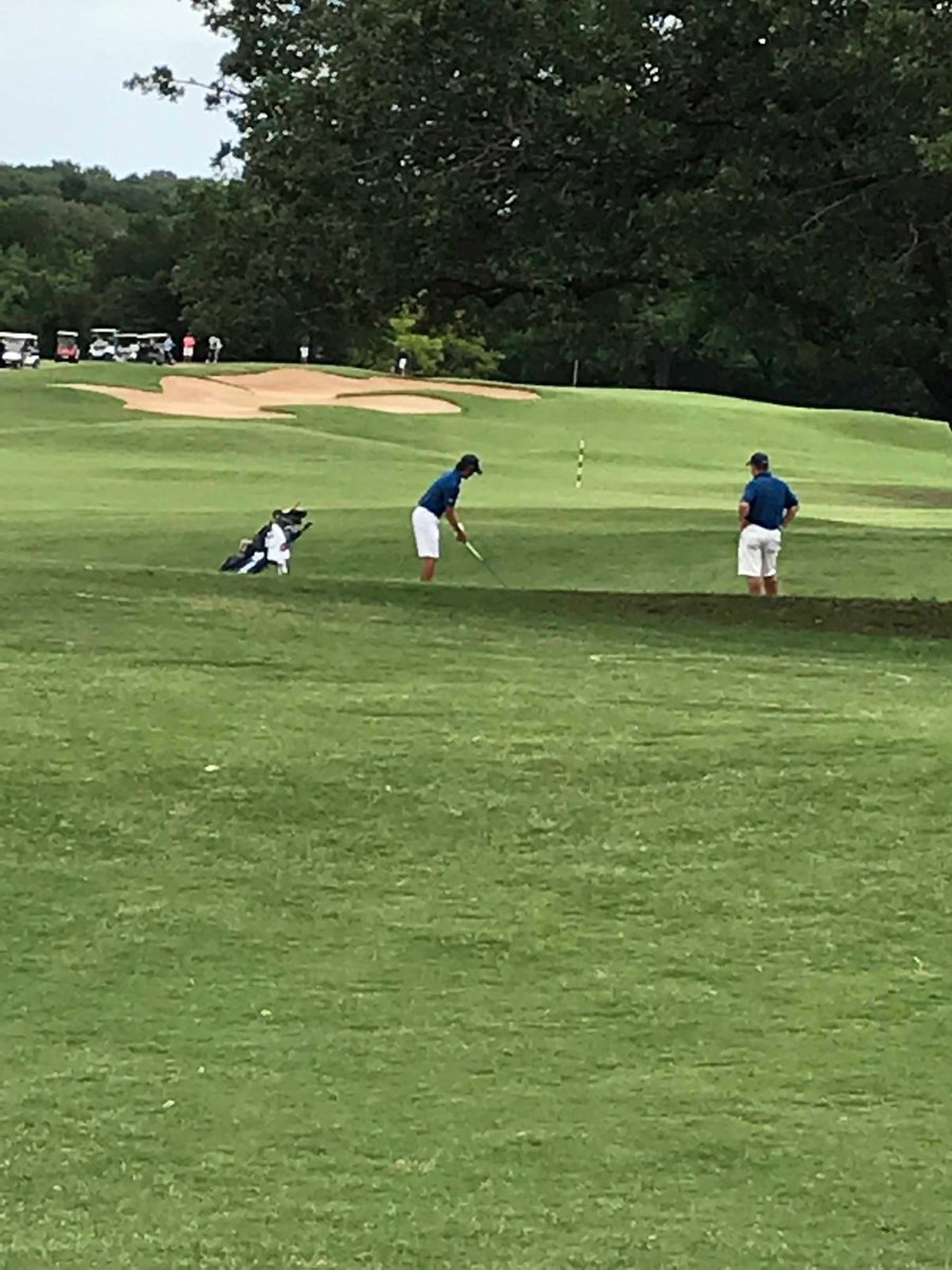 Josh Lim and Coach Martin take aim at the 7th.