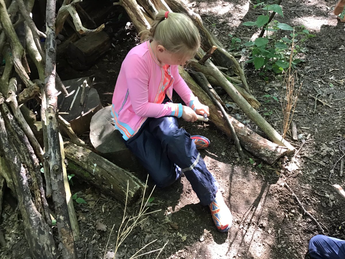AlexBradshaw's tweet photo. Inspired by Roxaboxen Grade Two set about creating their own town, a cookie cafe, police station, homes, pet shop (selling beetles) and a bakery to mention but a few. Using veg peelers to whittle down sticks for all kinds of construction 🚧🏗🏠@ACSEgham @ForestSchoolUK https://t.co/O97Tz2jug4