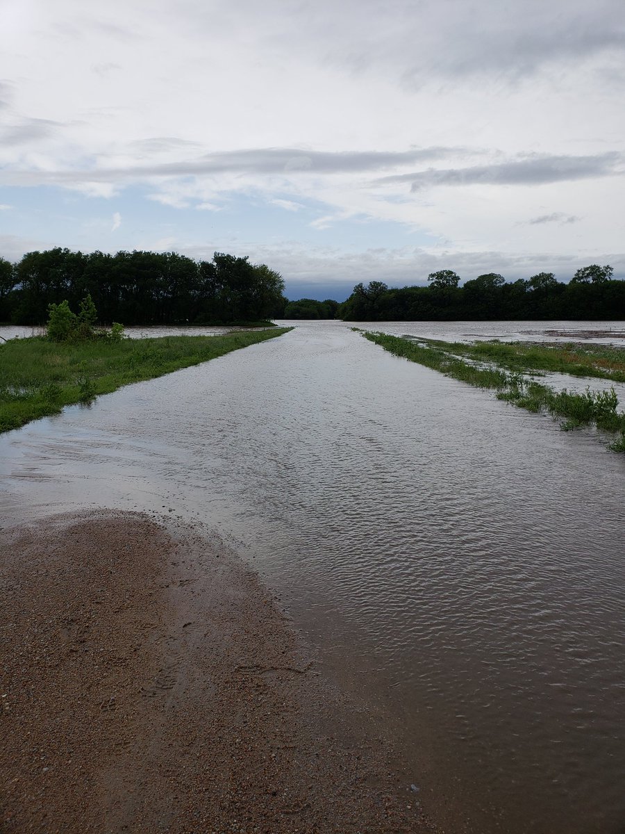 109th St. west of Meridian. Flooded roadways and fields on both sides.