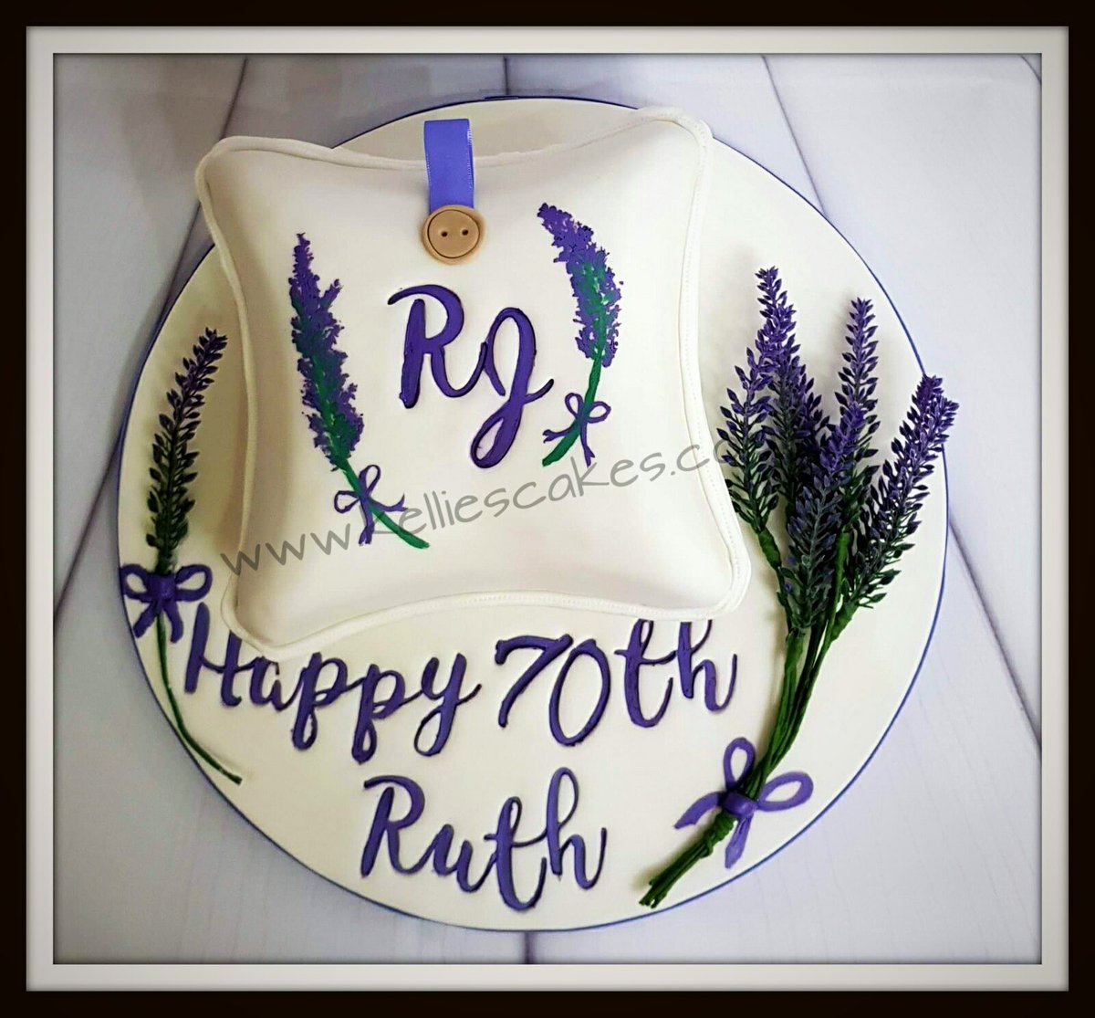 This cake was for a lady who makes lavender bags.  Cake is in the shape of the bag and decorated with handpainted lavender sprigs. #lavenderbags #handpaintedcakes #gantshill #cakemaker #springtime