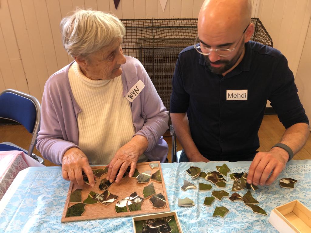 ToverCareUK's tweet photo. ...pupil encouraged an elderly lady to pop bubbles on the #magictable.
We also met Wyn. She's on her #dementia journey & is pictured with our co-founder playing one of the puzzles her husband makes her. A lovely moment shared. (2 of 2)
#happymoments #shift8 #mentalhealth https://t.co/lIfh0Yx8c8