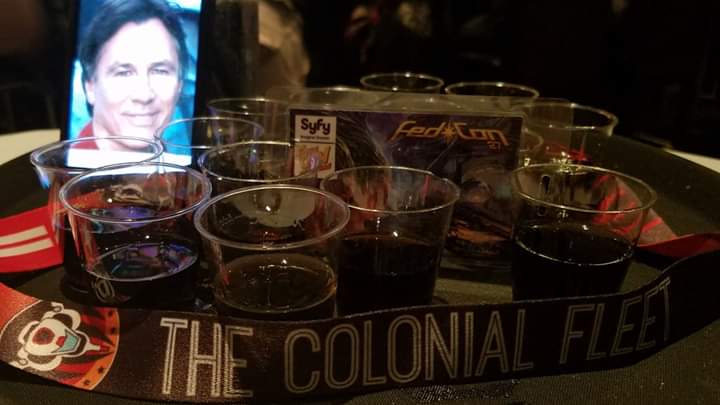 BSGmuseum's tweet photo. Remembering Richard Hatch today on his birthday, and also remembering how a small #ColonialFleet commemorative drink in his honor at Fedcon, turned into a convention-wide-standing-ovation one with the help of so many! @edwardjolmos @MaryMcDonnell10 @kandysemcclure @MichaelTrucco https://t.co/f4oSVPoOyV