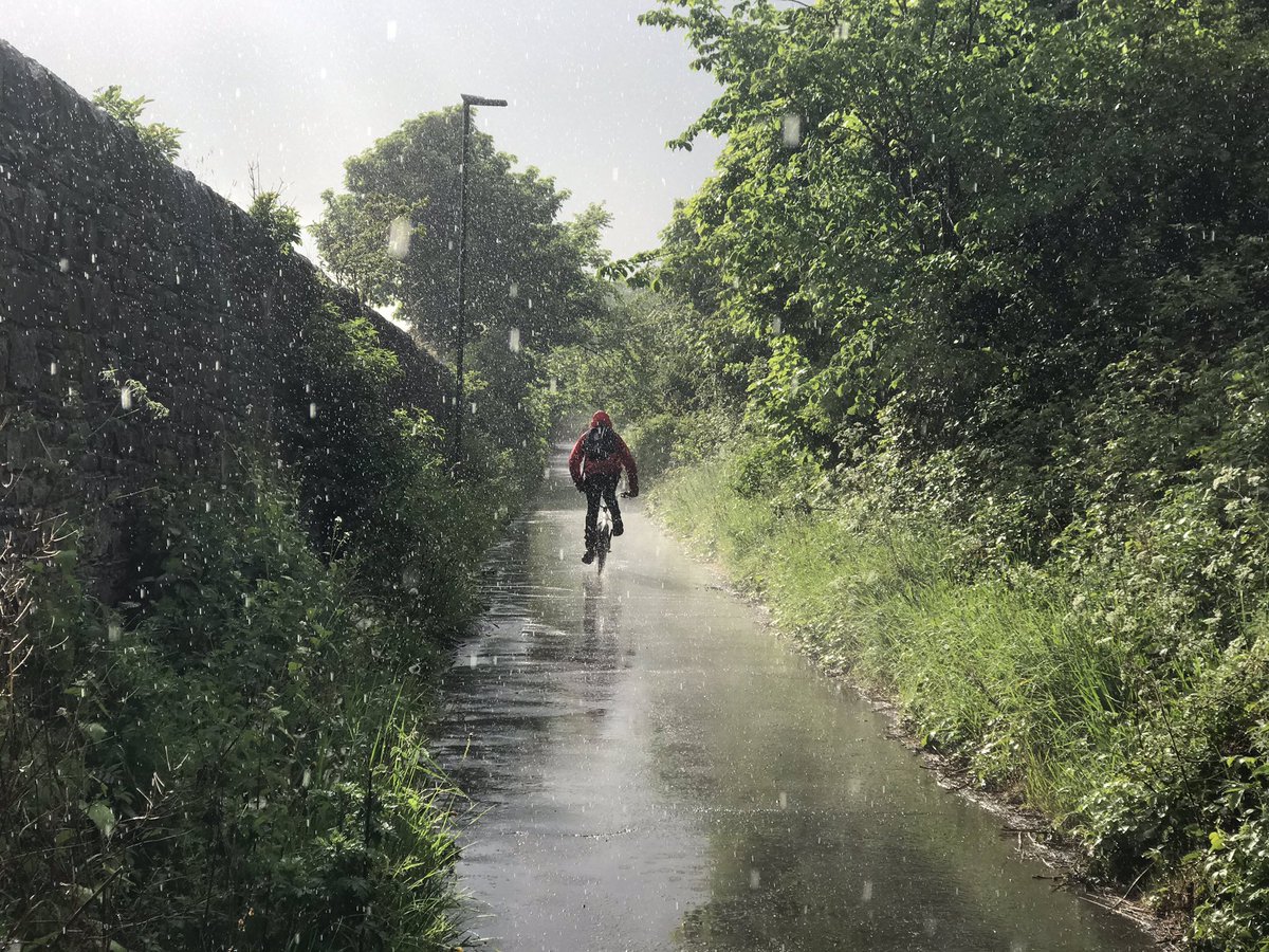 reizkultur's tweet photo. A thunderstorm on the commute home today, a pretty rare thing to happen. Pretty amazed by the ability of my iPhone to capture the moment on the Innocent Railway Path. Wet but impressive. Drying off now. #cycling https://t.co/10zz7co5b6