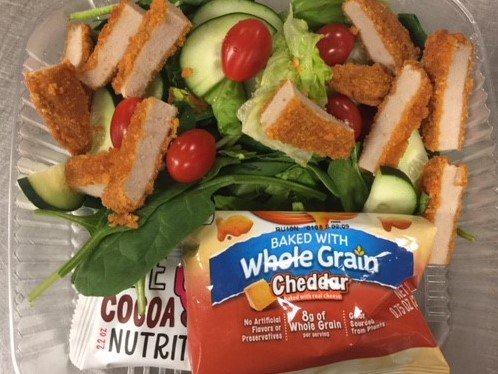 PSDNutrition's tweet photo. Tomorrow middle school lunch includes a buffalo chicken salad. This salad is made fresh in our kitchens using spicy breaded chicken and fresh cherry tomatoes & cucumber over crisp lettuce. Served with whole grain goldfish and a cocoa cherry bar! #saladtogo #freshoptions https://t.co/1SVhHSgVCC