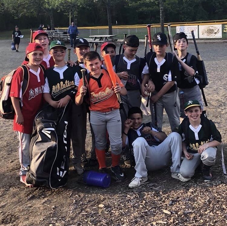 The Orioles' Otto Indelicato displays a “casualty” from NRLL’s Wood Bat Week. He's joined by fellow NRLL players (l to r) PJ Conte, Joey Dabrieo, Antonio Ricca, Gavin Brady, Zach Emery, Nick Torra, Lucus Acuna (sitting), Robbie Daley, Desi Brown, and Jason Berry (squatting).