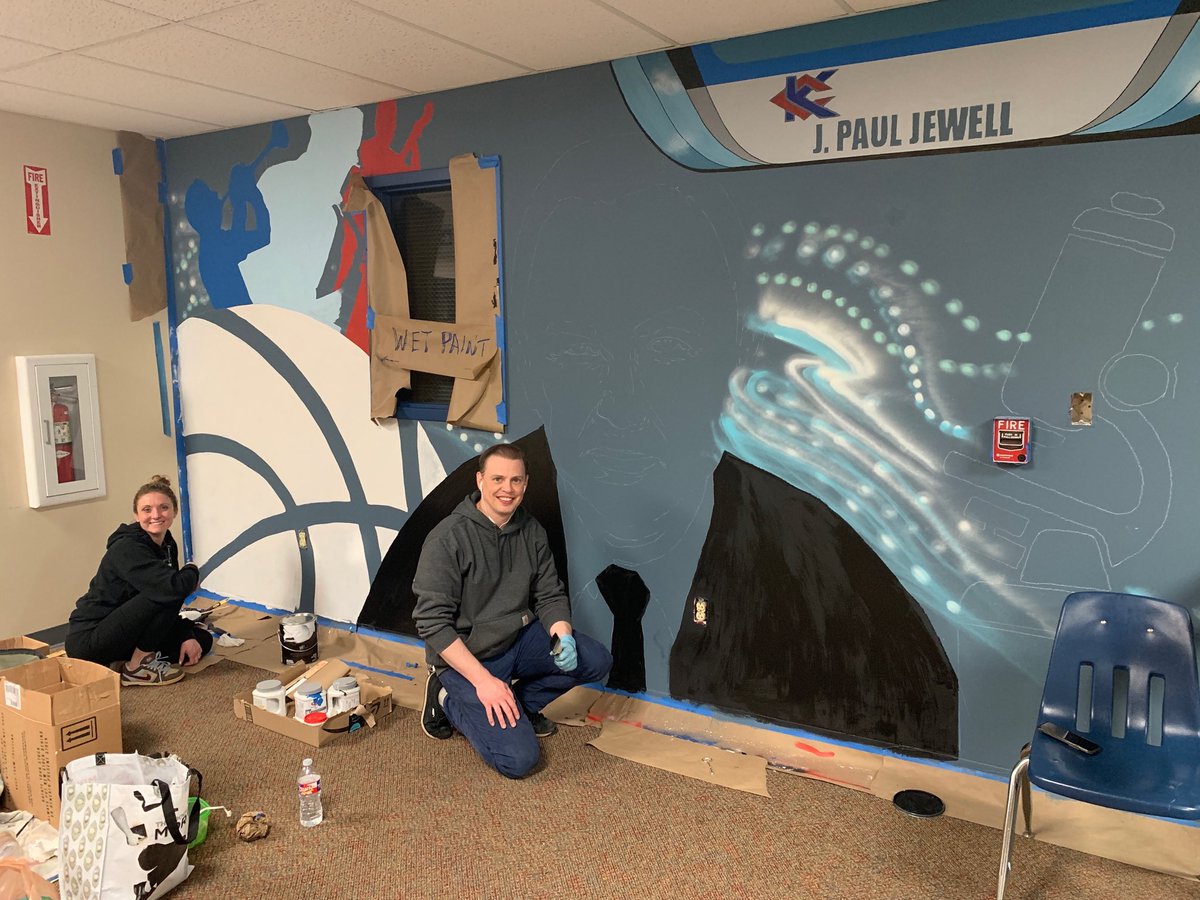 KCKCCPrez's tweet photo. What an exciting night! Walking through the halls and found artists Billy and Crystal Peters painting our first mural for @KansasCityKSCC #AmbientLearning Project. ‘A Tribute to Paul Jewell’. Adding color, art and history to KCKCC’s student spaces‼️ https://t.co/qhYCpWkOnb