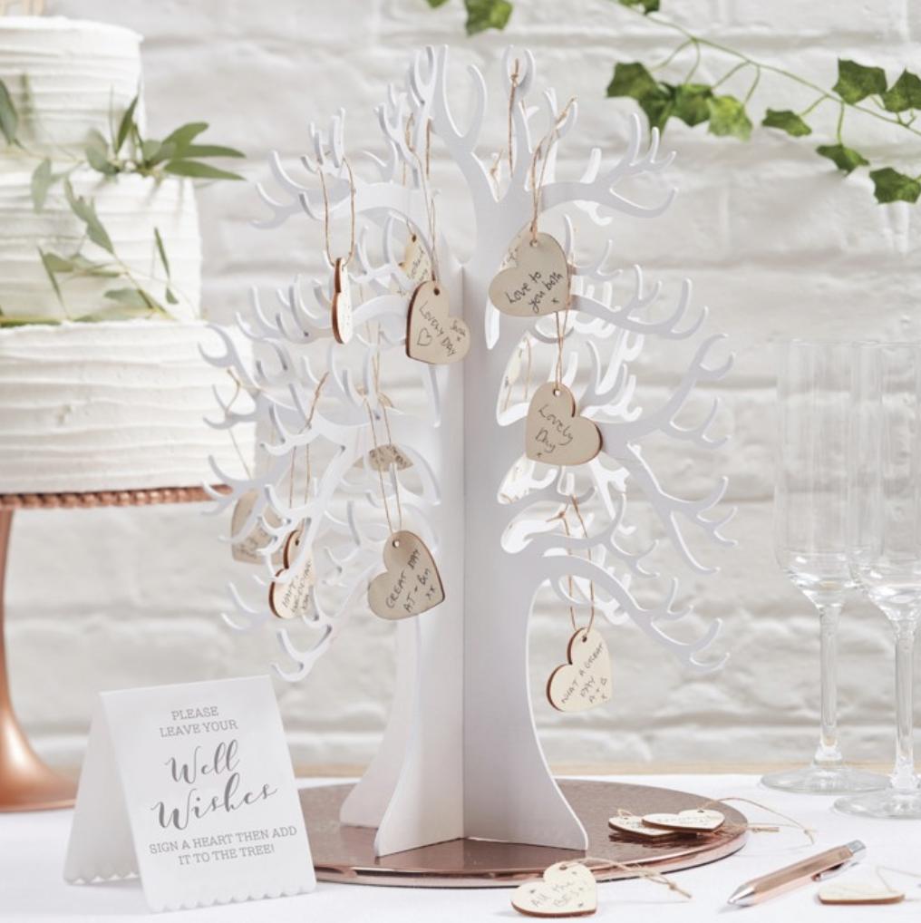 If you're looking for an alternative to a guest book, how about a wishing tree?

This white wooden #WishingTree comes with 70 blank wooden hearts for your guests to leave their wishes and hang them on the tree ❤️

Last few remaining: bit.ly/2Jywfpo 

#WeddingHour #Decor