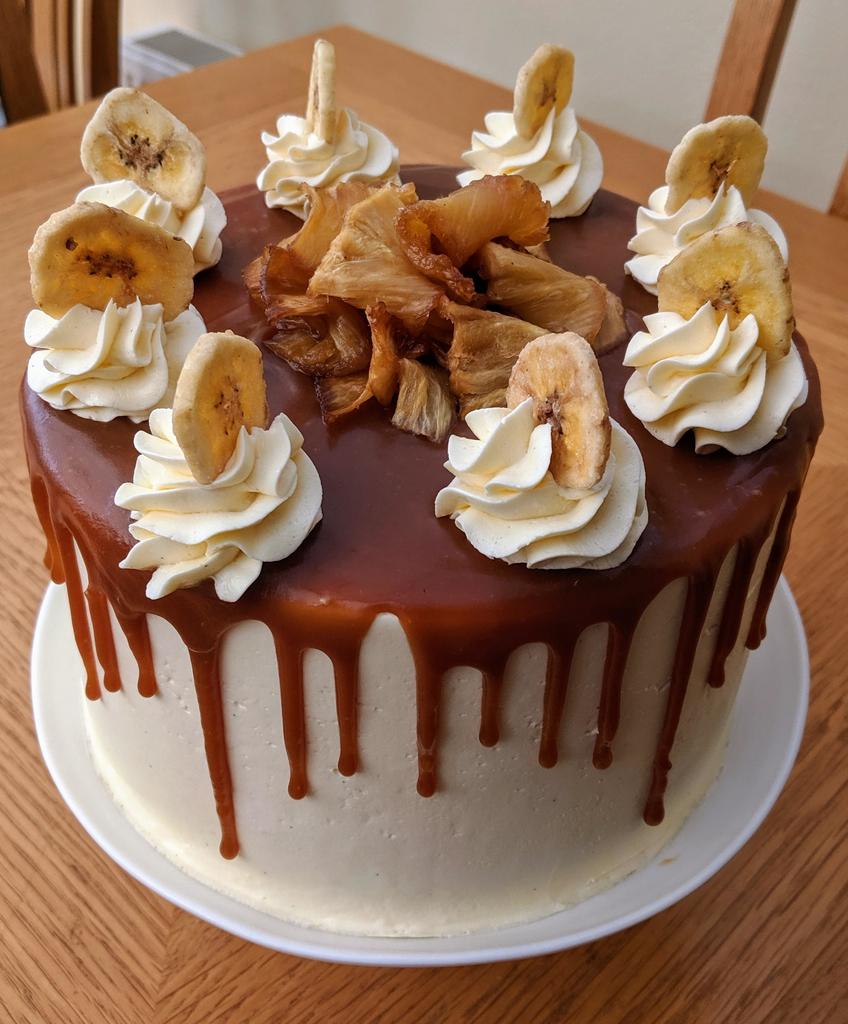 Cute_and_Food's tweet photo. "[OC] I made an island-inspired cake as I dream of warmer weather. Banana cake, rum-roasted pineapple filling, butter rum caramel drip and vanilla bean frosting" via #FoodPorn Subreddit - Courtesy of nobleland_mermaid. https://t.co/zz9DJ6E1u2
