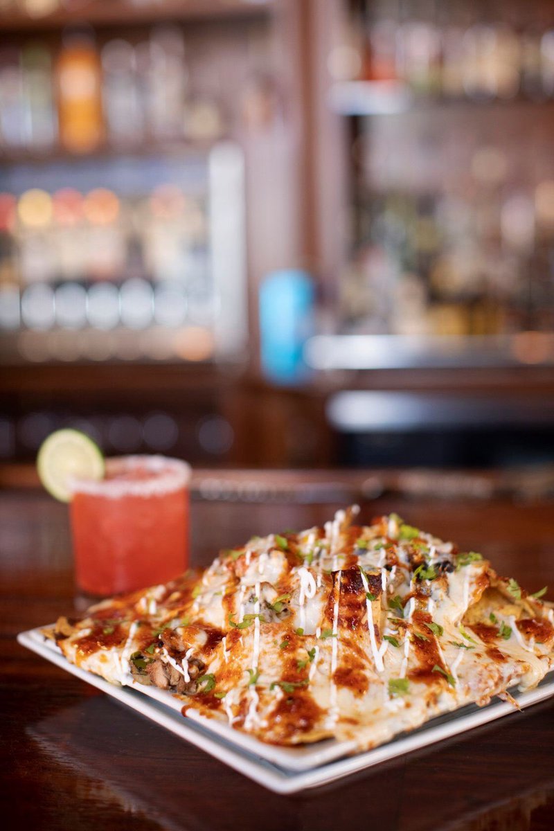Zannottis's tweet photo. Everyone favorite is the special this week! Duck Nachos paired with a blood orange margarita. Order the pair and get 10% off 🍷 https://t.co/mKcHCvEK5j