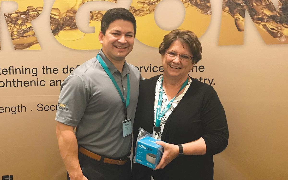 ErgonOils's tweet photo. Congrats to Dona Nijak with @HillandGriffith — winner of one of the Echo Dots Ergon is giving away this week at #STLE2019 in booth 505-507. Dona is pictured here with Ed Torres, Ergon Sales Executive, Specialty Base Oils – North America. #hygold #baseoils https://t.co/VfErPSxv4d