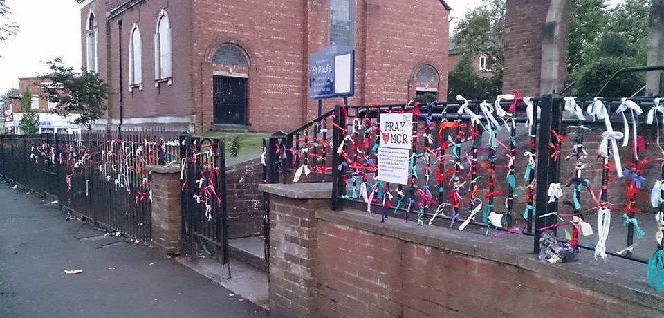 blackleycofe's tweet photo. Two years ago, Blackley families started to tie ribbons to the church railings as we remembered lives lost. Today, some of the children who tied them prayed with us with the artwork created from the ribbons @BlackleyAcademy #RememberingManchester https://t.co/qM6bcXF3yD