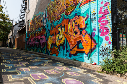 Looking for cool street art in #Toronto? You'll find this colourful side street in Kensington Market.