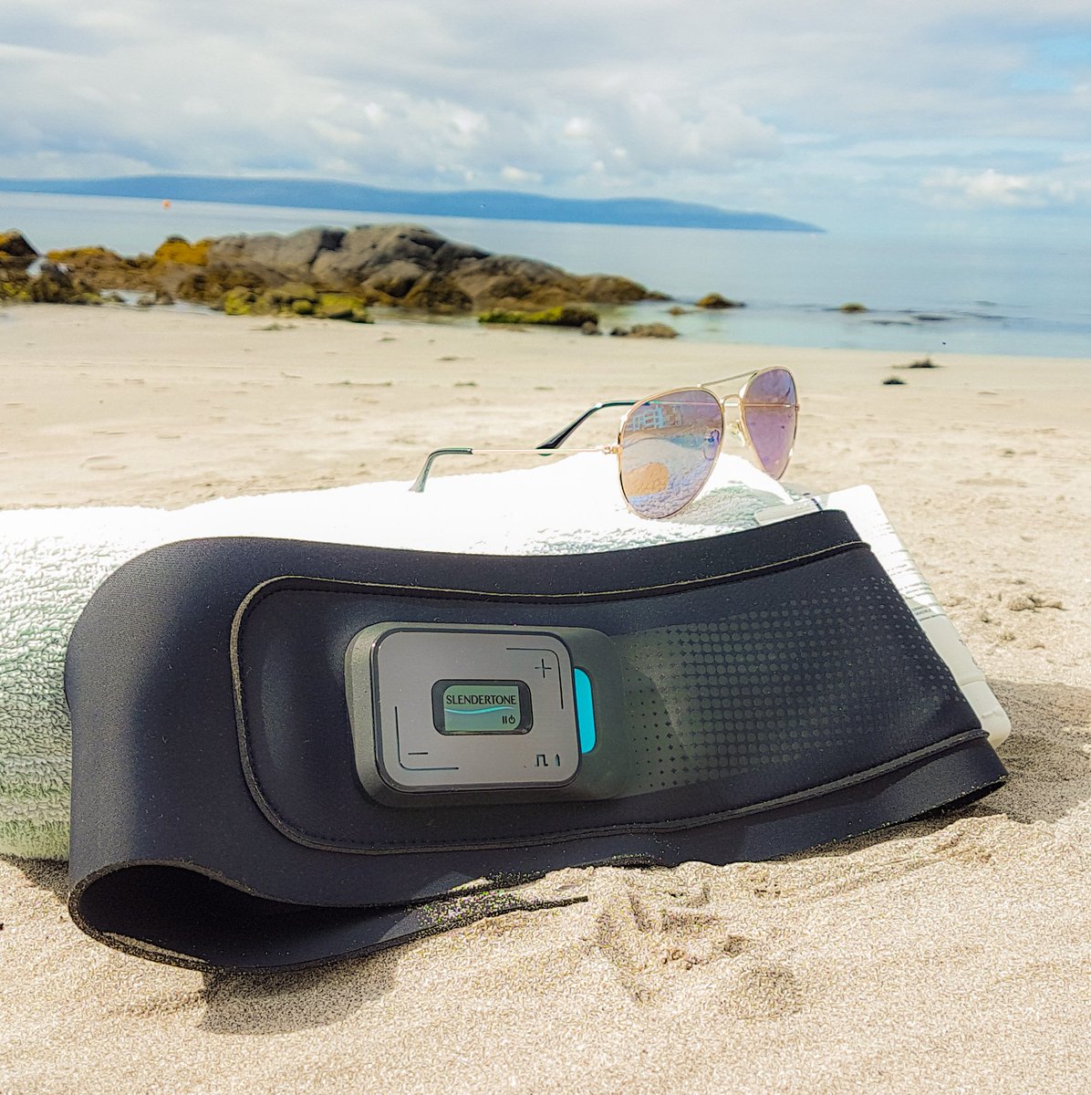 Slendertone's tweet photo. Tone and tan this summer season. Why not shake up your beach routine and fit in a toning session while you take in some rays – summer season is finally here! 🌴 #slendertone #connectabs #summer #beachseason #technology #toning #tech https://t.co/3fvJRKjIQ4