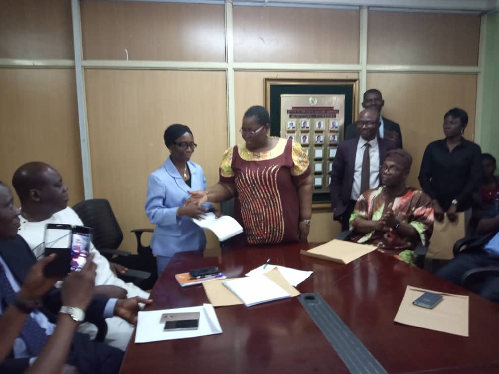 followlasg's tweet photo. The State Auditor-General, Mrs Helen Deile presenting the Permanent Secretary State Treasury Office, STO/State Accountant-General, Mrs. Abimbola Umar the duly audited and signed Y2018 Financial Statements #AmbodeLegacies #LASG #ItesiwajuIpinleEko https://t.co/Vhkoty3OEi