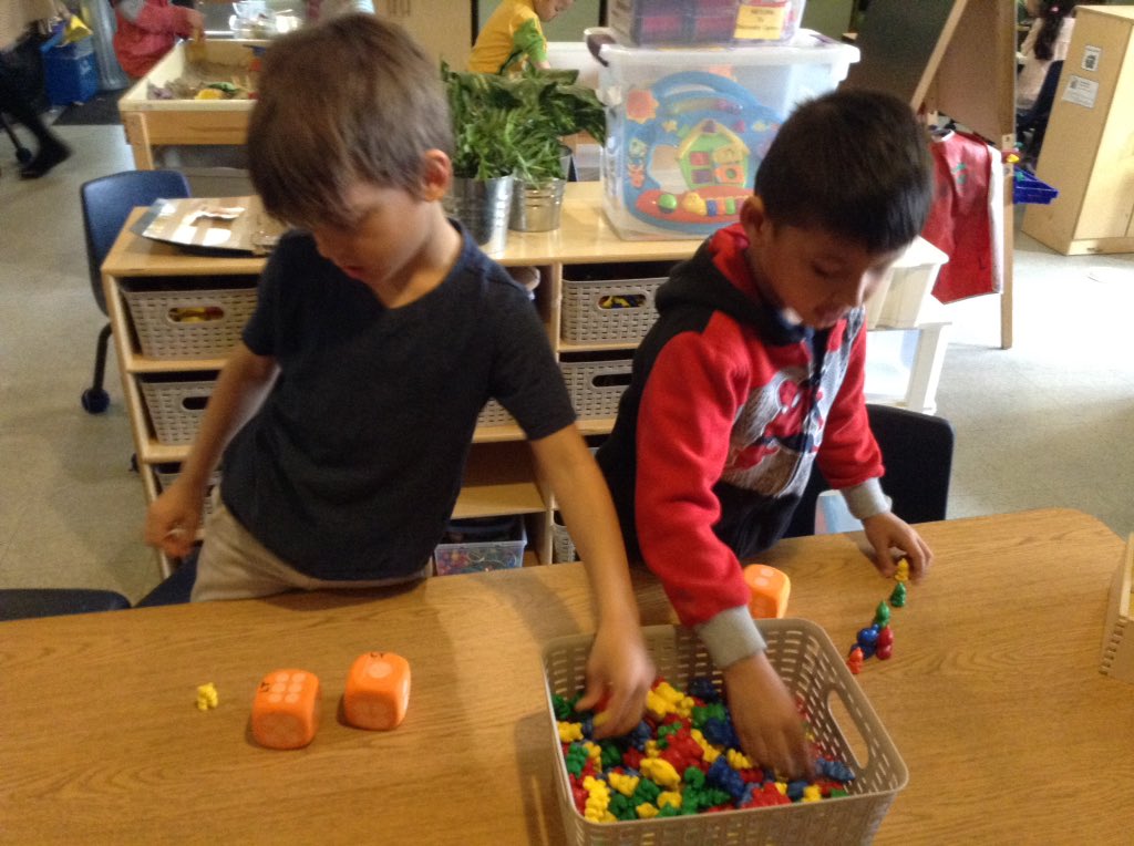 SIBFDK2's tweet photo. We are trying to be more intentional with materials and how we use them. First, the boys just had the bears all over the table. By adding dice, they began working on addition, and comparing how had more, and it became a game! #HWDSBkinder #math #games @SIBhwdsb https://t.co/4f1HA0OA3M