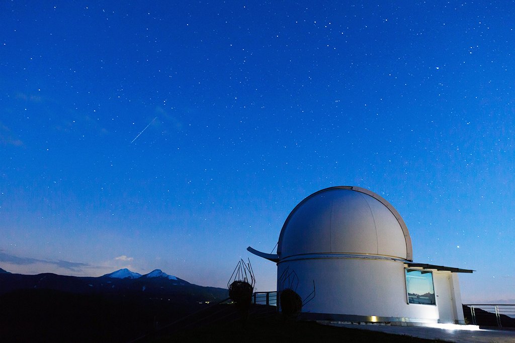 a photo of an obseravtory at dusk