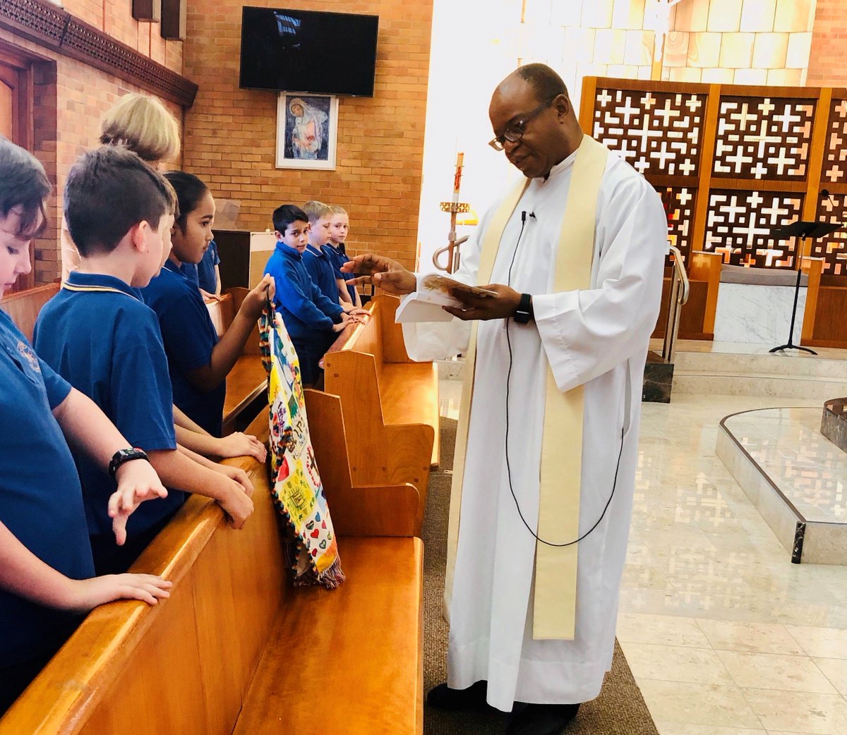 StThom_CampHill's tweet photo. Student Compassion Cloak Tour - Year 4 Blue - Today we took our Student Compassion Cloak to Friday morning Mass. Fr Christopher blessed it with Holy Water. It was a special occasion for our class given the significance of our cloak! #WearCompassion #BeingNeighbour #HereIsTheLove https://t.co/OIEuVJsU8x