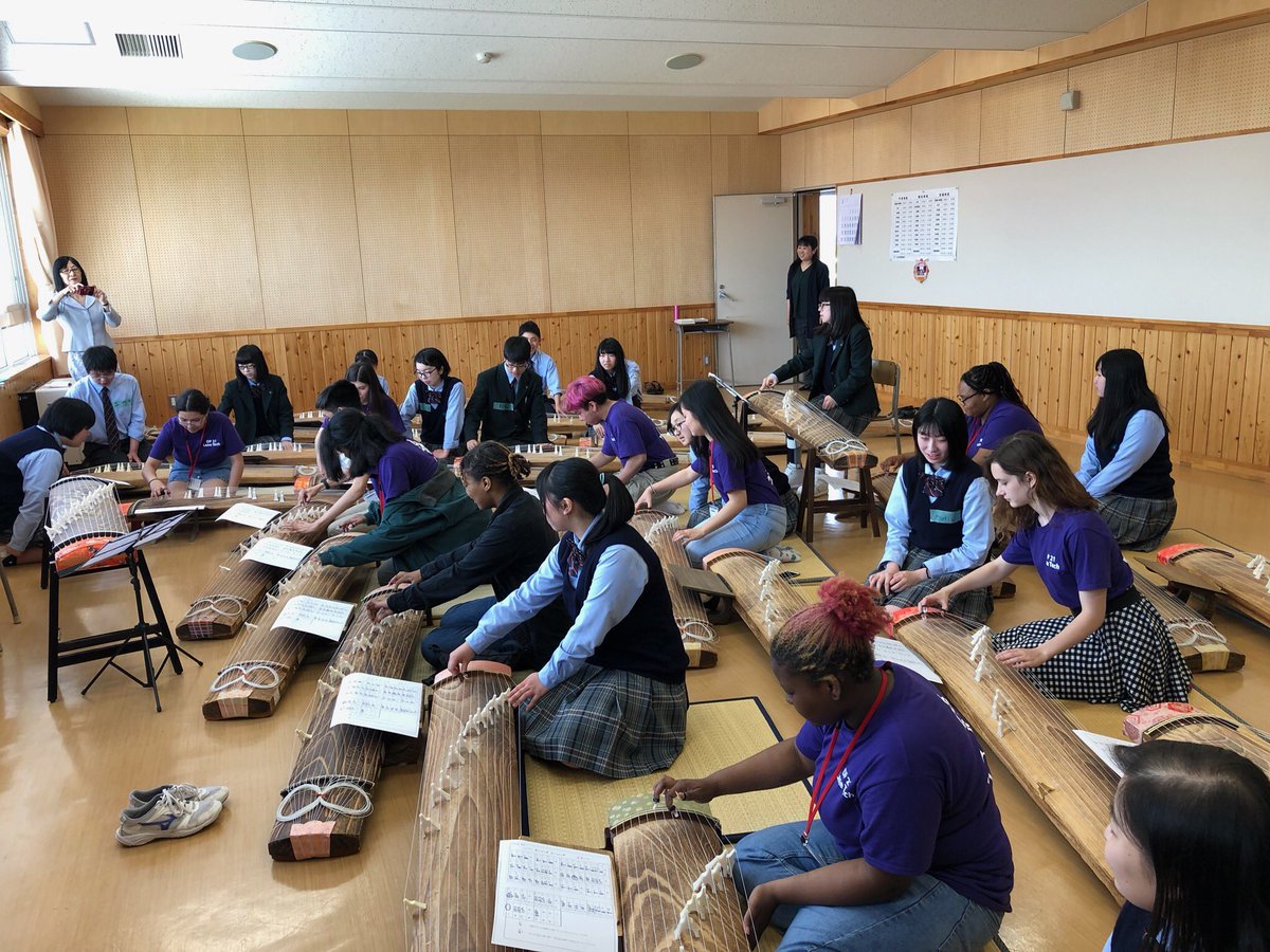 LaneTech1440's tweet photo. More fun for our students in Japan! Picture of our students being taught by Mizusawa Daiichi High School students to play the Koto. https://t.co/MnU1R8vaFm
