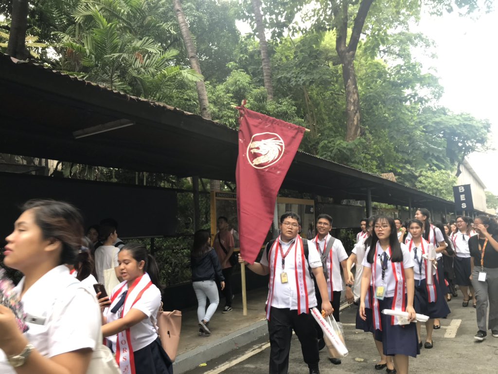 assoc_ust's tweet photo. The Asian Studies Seniors are now marching towards the field!

#VictorsofAB 
#BaccalaureateMass2019 
#OneAS https://t.co/3uyTo7uhXD