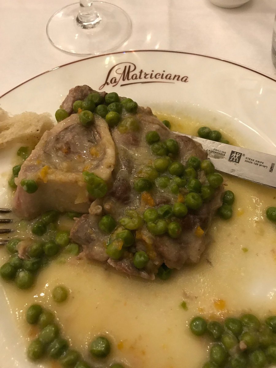 Ossobuco di vitella in bianco con piselli , braised veal shank with peas