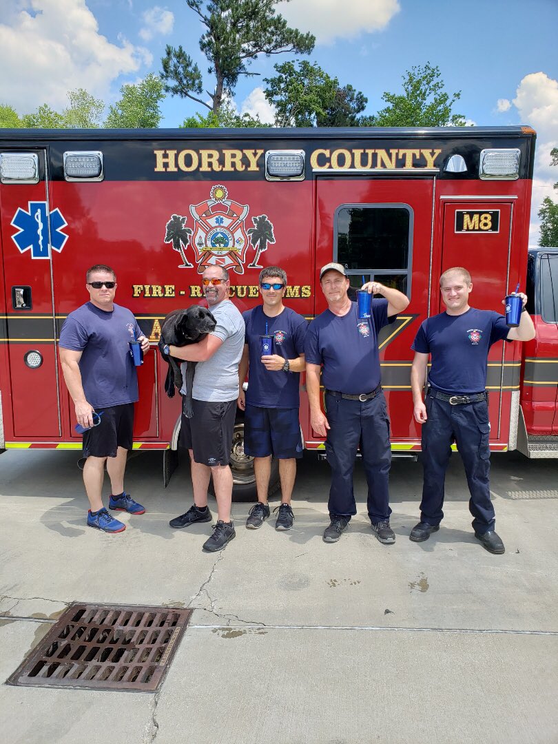 hcfirerescue's tweet photo. Station 8 dog Molly wanted to pose with our #HCFR first-responders as they were gifted #NationalEMSWeek2019 cups as tokens of appreciation. #HCFREMS #BeyondTheCall https://t.co/HvIEXlsdhl
