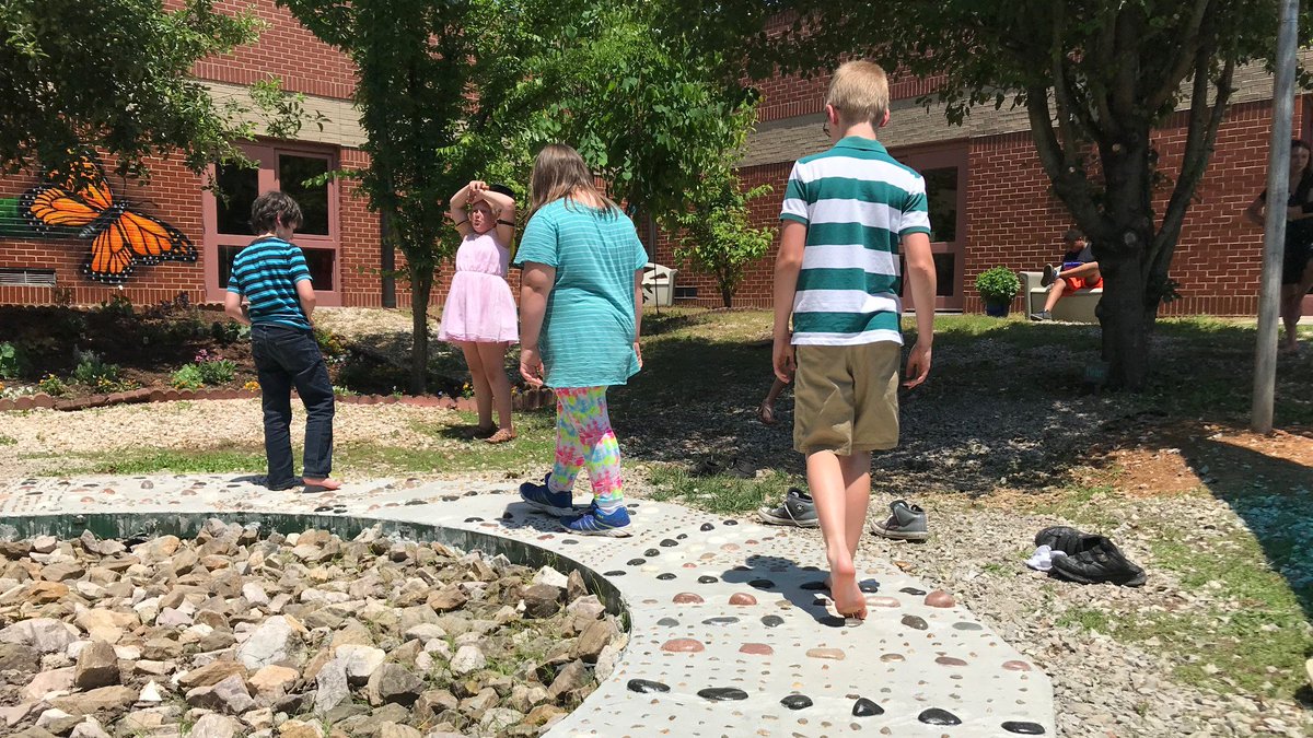 KnoxSchools's tweet photo. A tinkering wall, a life-cycle mural and a calming footpath are all part of a new Outdoor Sensory Courtyard that was unveiled on Wednesday at Dogwood Elementary! Check out the story on Hall Pass: https://t.co/btVnFmC3Un. @LanaSheltonLow https://t.co/2xF7I0GiYV