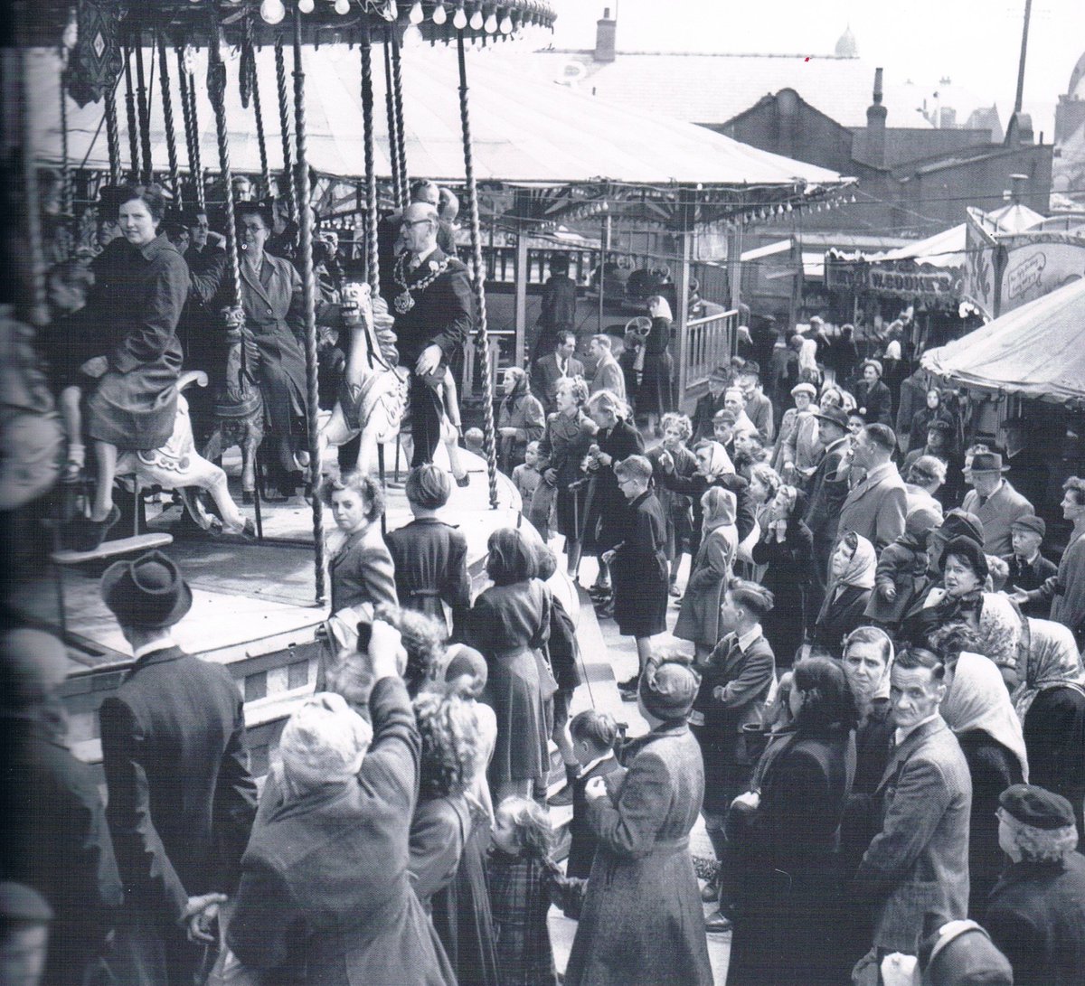 TrueNorthBooks's tweet photo. Crowds are enjoying Wakes Week Fair in Oldham in the early 50s. Photograph taken from our #Oldham selection: https://t.co/OpoqRJVgfM https://t.co/QdFBTj4ssF