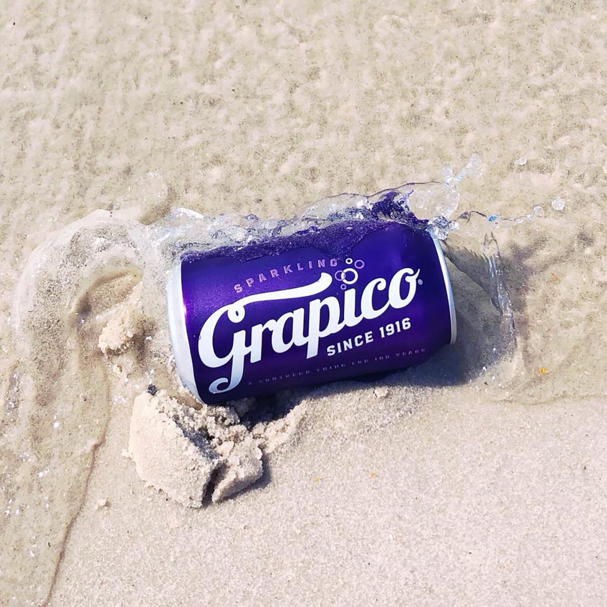 Grapico's tweet photo. If there's one thing more southern than sand between your toes on Memorial Day weekend, it's the ice cold deliciousness of a freshly cracked Grapico. #ASouthernThing https://t.co/9tUn3RLvZi