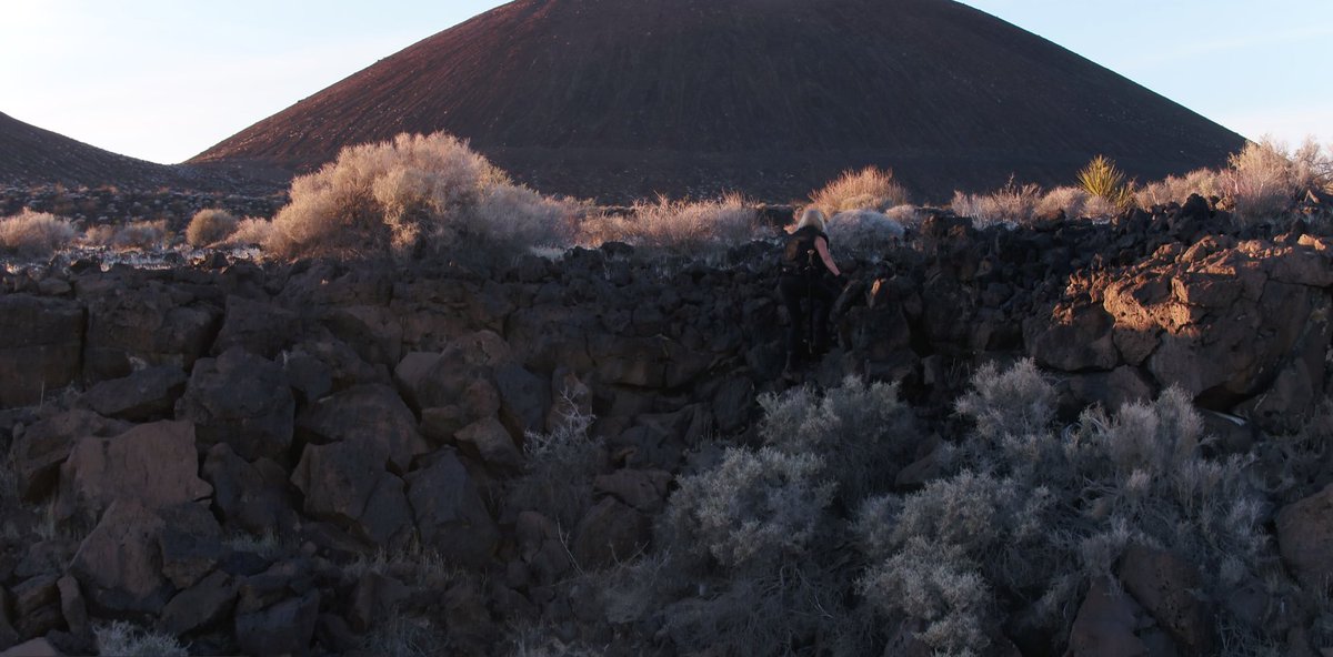 DirectorNeil's tweet photo. And then there’s the day where I asked my esteemed actress to climb a small cliff and run to a volcano... #ageofdarkness #evolutionwar @traceybirdsall1 https://t.co/x89HWKNXOq