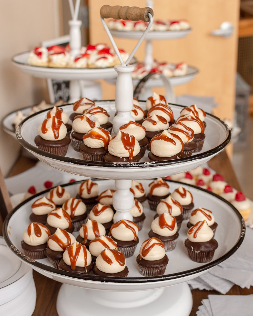 Our chocolate sea salt caramel cupcakes are a real crowd pleaser. We fold homemade caramel in to the buttercream and drizzle some on top.  The secret to our chocolate cake is to substitute some of the liquid in the recipe for coffee to enhance the chocolate flavor. #cupcake #cake