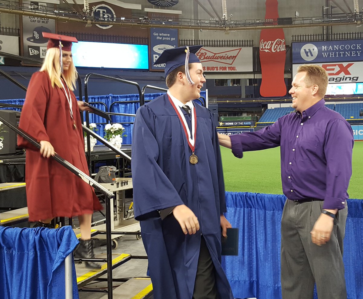 my_pcs's tweet photo. The awarding of diplomas is underway for Palm Harbor University High seniors! #PCSGrads #PHUH #PCSProud https://t.co/bRZwQTLyQB