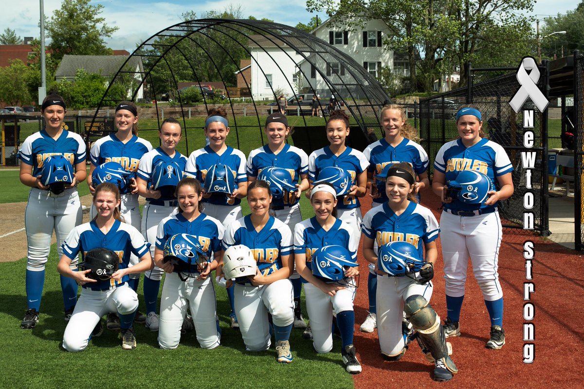 Butler softball is Newton Strong wearing white ribbons during their playoff game today