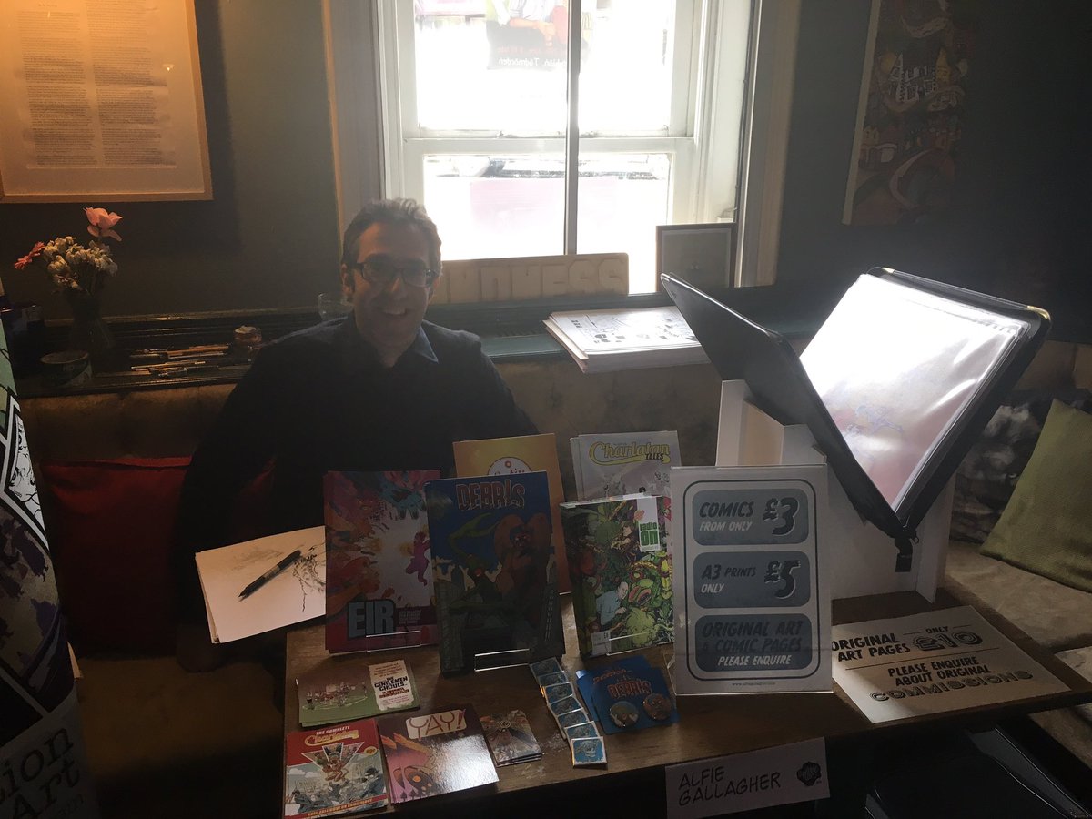 russell_payne's tweet photo. All set up at #scribblecon. Free entry and a great diverse range of comics, zines and art. And it’s IN A PUB! Come to Todmorden now!! @JasonGarrattley @GirlingMatt @AlfieGallagher https://t.co/p6LHuzRMJo