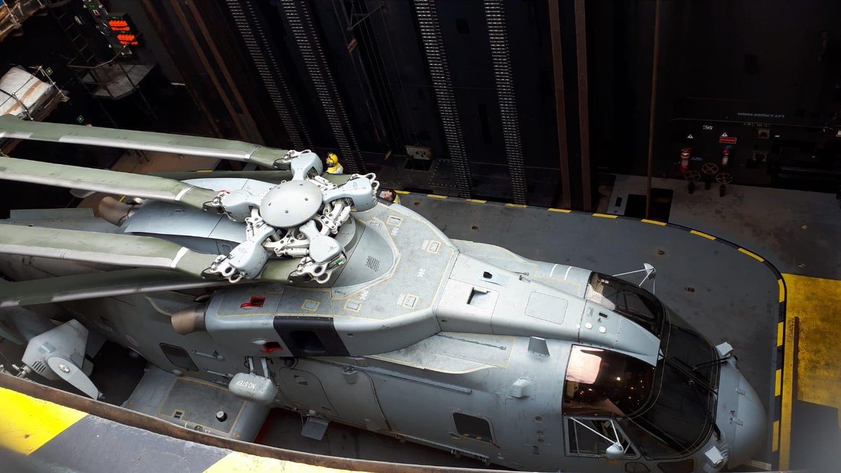 RNASCuldrose's tweet photo. @pdnr777 @RFAArgus @RFAHeadquarters Yes @RFAArgus does have a hangar. Hereโs one of our Merlin Mk2s going down the lift to the hangar on - all expertly moved by Aircraft Handlers from 1700 NAS #SafeInTheseHands https://t.co/HQGRB6AUji