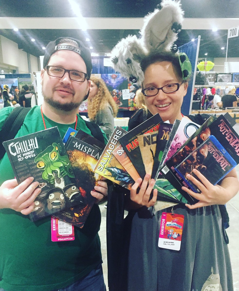 SourcePtPress's tweet photo. These two hit the  #Sourcepointpress MOTHER LOAD! These comic fans verbally expressed their love of indie and boy did they SHOW it here at @GalaxyConRich! THANKS SO MUCH, GUYS! #comics #scifi #horror #rottentail #norahcomic #salvagersseries #plaguedoktor #themisplaced #cthulu https://t.co/x2xmfgesu5